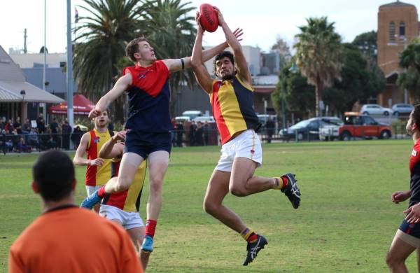 Pat Nicholls displays his aerial prowess with a strong contested grab.