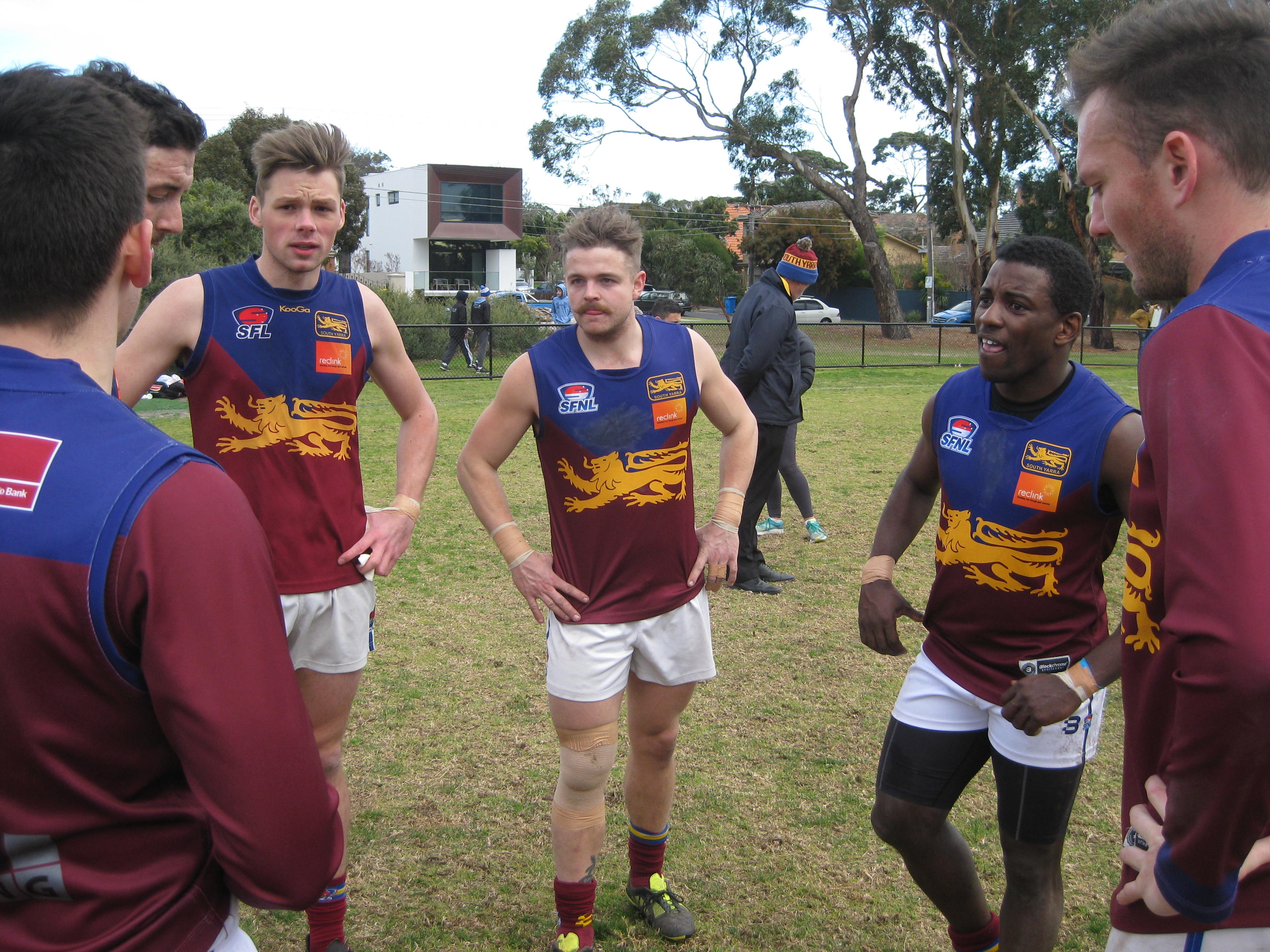 Mwaba (second from right) in the South Yarra huddle.
